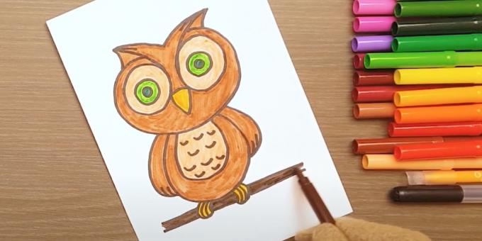 Hur man ritar en uggla: måla över ögonen, benen och en gren